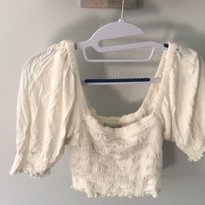 White Urban Outfitters small off the shoulder top.